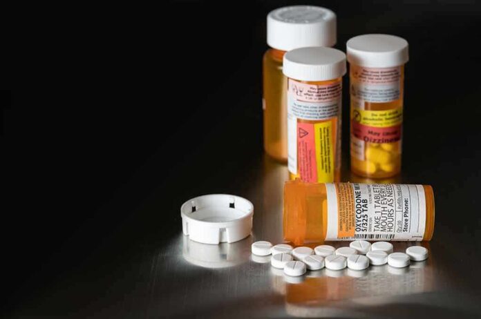 Prescription pill bottles and tablets on a table