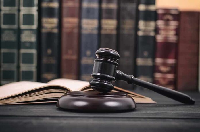 Gavel and open book in library setting