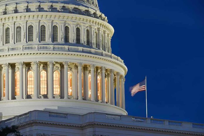 US Capitol building with American flag illuminated