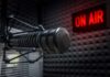 Microphone in studio with On Air sign.