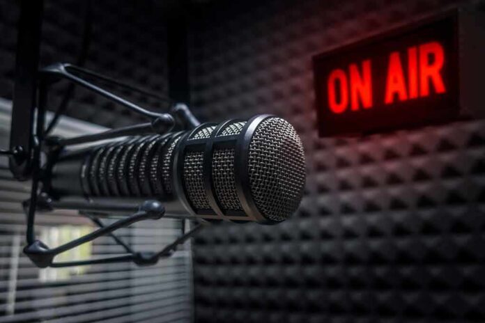 Microphone in studio with On Air sign.