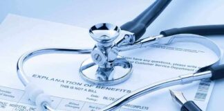Stethoscope and pen on medical benefits document