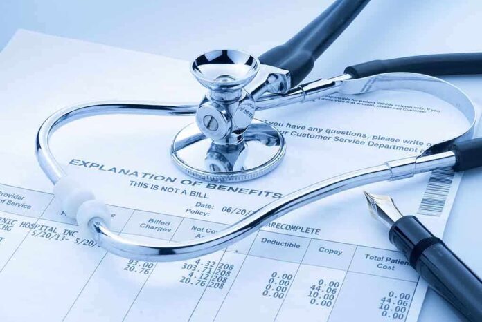 Stethoscope and pen on medical benefits document