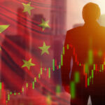 Man with chart and China flag background