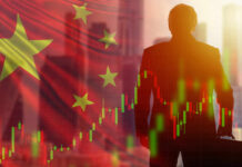 Man with chart and China flag background