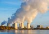 Nuclear power plant cooling towers emitting steam.