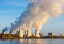 Nuclear power plant cooling towers emitting steam.