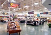 Supermarket interior with various food sections and displays