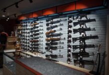 Wall mounted guns displayed in a store