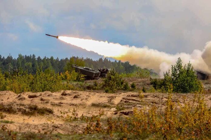 Military tank firing a missile in forest area