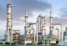 Industrial plant with metal towers and pipes