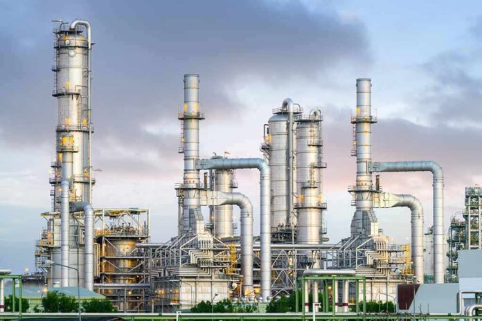 Industrial plant with metal towers and pipes