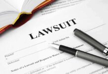 Legal document titled Lawsuit with pen and book
