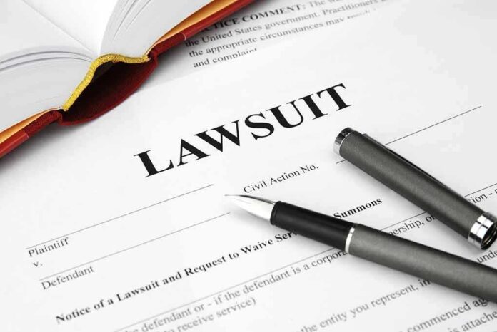 Legal document titled Lawsuit with pen and book