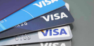 Stacked Visa credit cards in various colors