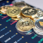 Cryptocurrency coins on a trading screen background