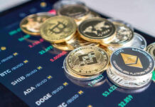 Cryptocurrency coins on a trading screen background