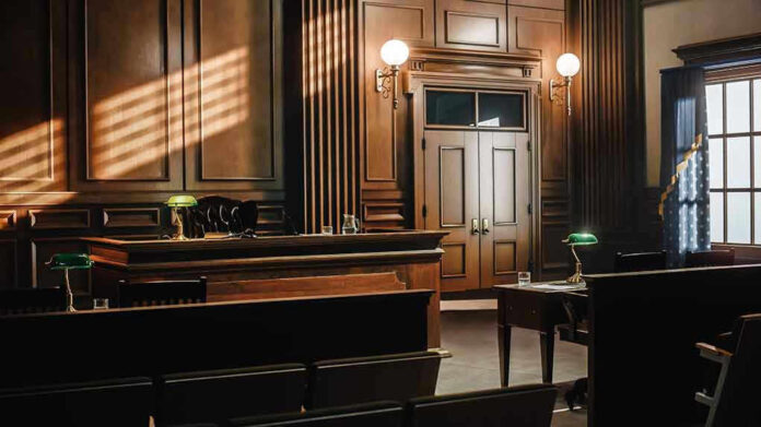 Empty courtroom with wooden interior and green lamps