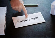 Envelope with YOU'RE FIRED and pointing finger.
