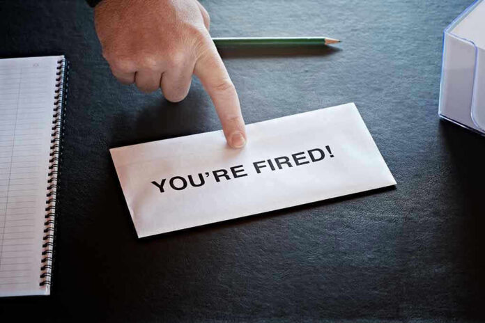 Envelope with YOU'RE FIRED and pointing finger.