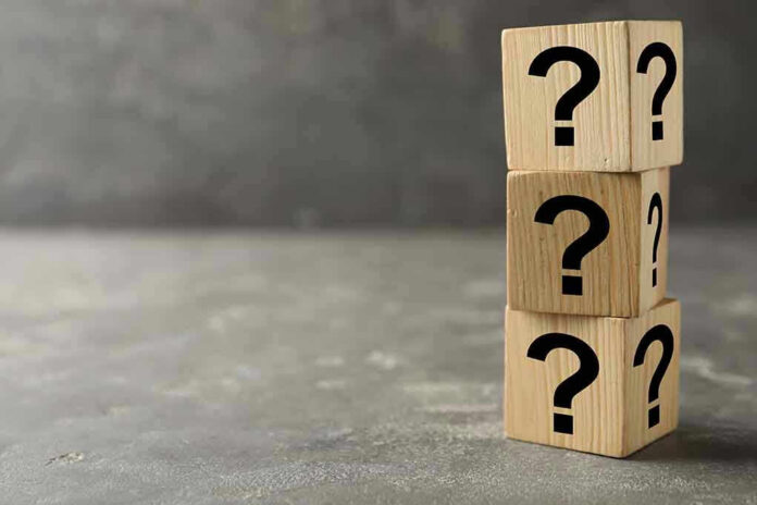 1692246943 Three wooden blocks with black question marks stacked.