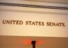 Sign displaying United States Senate in a government building