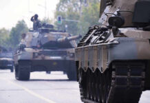 Ukraine Conflict TRIGGERS Massive Tank Revolution Tanks on a road with soldiers inside.