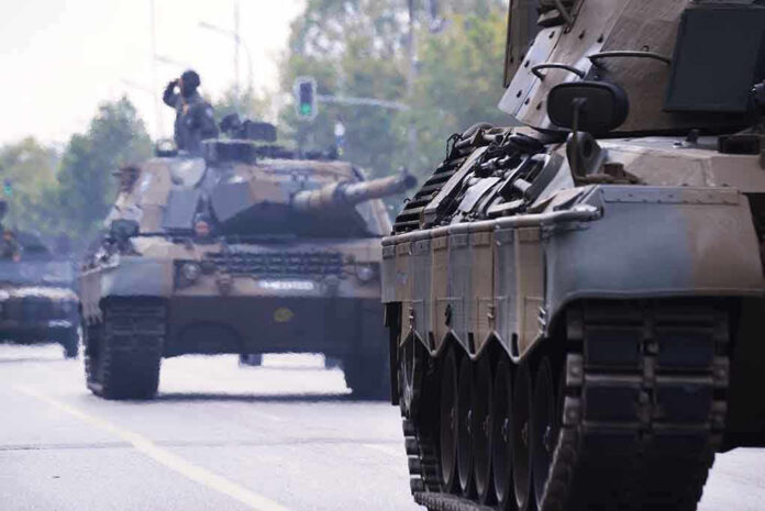 1200057271 Tanks on a road with soldiers inside.