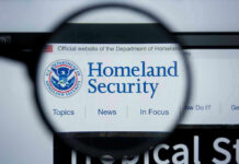 British Journalist DETAINED — Trump’s Hardline Move Magnifying glass showing Homeland Security website.