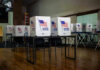 Voting booths set up in a room.