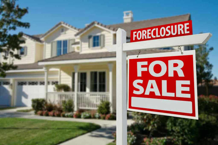 50097061 House for sale with foreclosure sign.