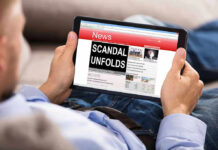 Explosive Insider Scandal Rocks NJ Governor Race Person reading tablet with headline Scandal Unfolds.