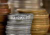 Left Defends SHUTDOWN — Massive FOREIGN LGBTQ Funding Prioritized! Stack of coins labeled funding with other coins stacks