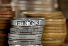 Stack of coins labeled funding with other coins stacks