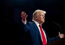 Trump Honors Champs — Traditional Values Celebrated! A man in a suit gesturing during a speech