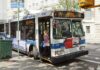 Harris Throws Biden Under Bus — AGAIN! A woman boarding a clean air hybrid electric bus at a city stop