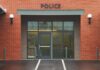 Entrance of a modern police station with brick facade