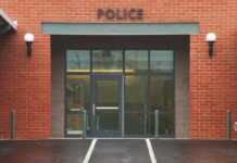 Entrance of a modern police station with brick facade