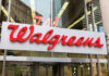Walgreens Recall — NEW, URGENT Bacterial Contamination Crisis Walgreens store entrance sign with city reflections.