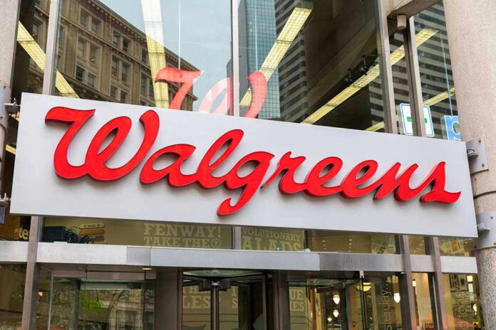 Walgreens store entrance sign with city reflections.