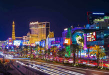 Las Vegas Strip at night with bright neon lights.