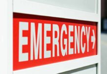 VP Motorcade DISASTER — Officer Fights Death Emergency sign indicating direction with a red background and white text