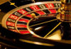 Shots Ring Out at CASINO — Massive Security RESPONSE TRIGGERED Close-up of roulette wheel with spinning ball.