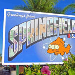 Greetings from Springfield sign with three-eyed fish.