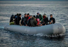Deadly Mediterranean Capsize Exposes Europe’s Open-Door Lie People on a packed raft in open water.