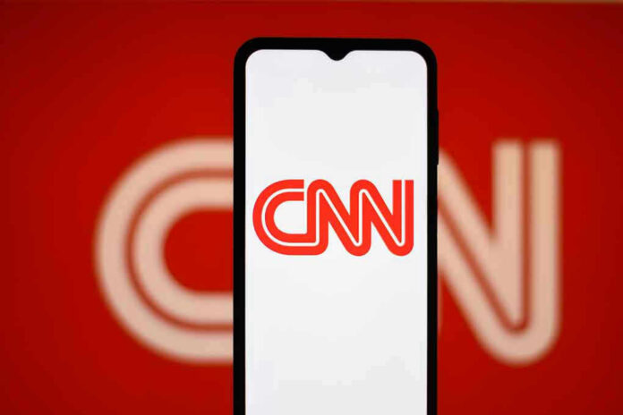 2442890737 CNN logo on a phone screen.