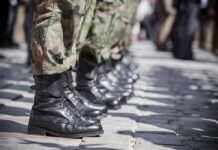 Trump Blames Biden: Refugee Program ‘Endangers Us All’ Row of soldiers in camouflage pants standing in formation with black boots