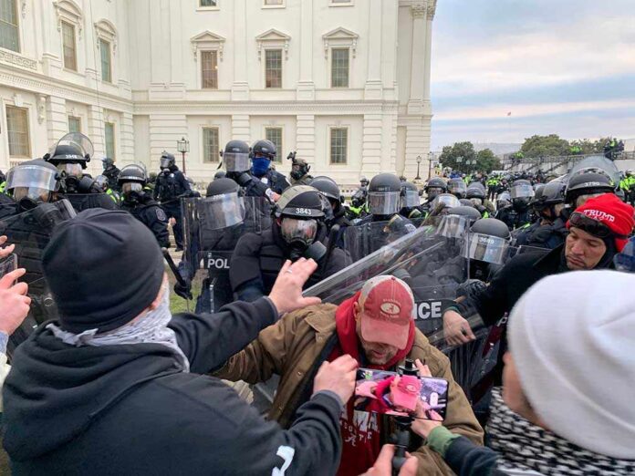 shutterstock_1888654234.jpg A tense standoff between protesters and police at a demonstration