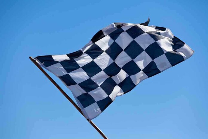 shutterstock_59484145.jpg A checkered flag waving against a clear blue sky