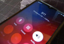 Phone screen showing 911 emergency call in progress.